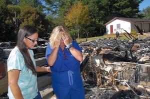 Burned Tennessee couple, Laura and Carol Ann Stutte, whose home was burned to the ground and whose garage was spray-painted with the word "QUEERS."